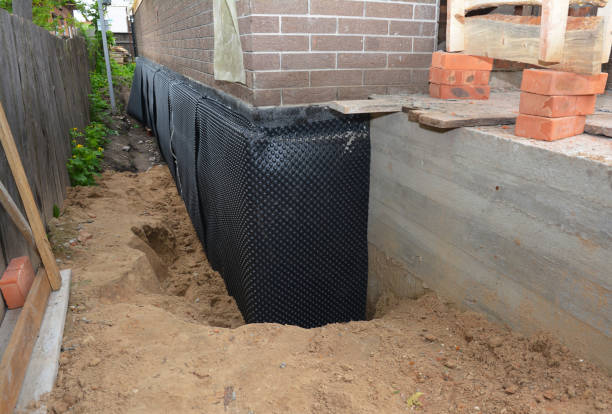 Happy homeowners after waterproofing job in Elbridge